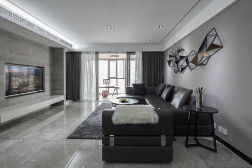 空间以灰色为主色调水泥质感的地砖搭配真皮质感沙发奠定了空间