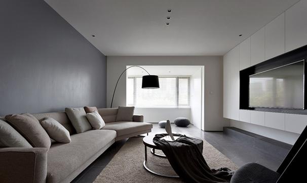 客厅区域相对独立灰色墙面及灰色大理石地面的融合保证了整个空间的