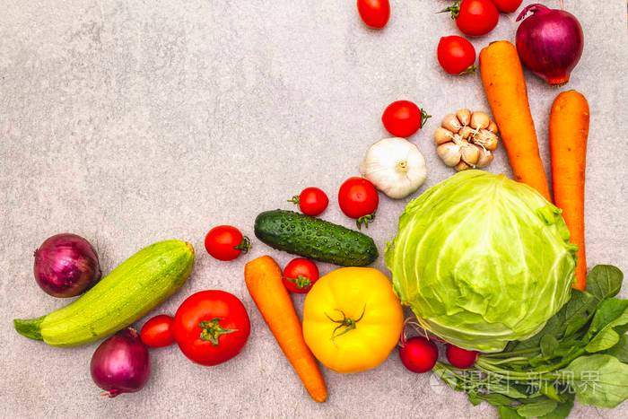 各种新鲜有机蔬菜食物烹饪石背景健康素食主义者素食主义者的饮食理念