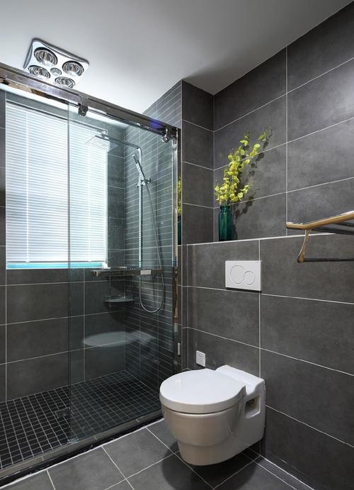 卫浴间装修设计偏重现代深灰色的墙砖搭配入墙式的马桶现代简约范儿