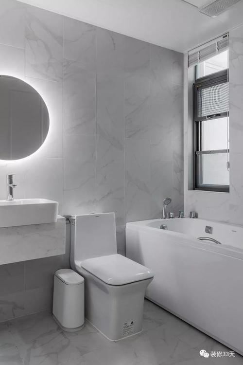 浅灰色石纹瓷砖悬挂式台盆柜点缀自带光源的墙镜简洁干净