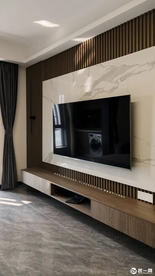 电视墙采用经典的岩板格栅悬空柜的形式电视柜悬空布局视觉更加轻盈