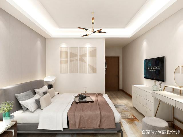 卧室的墙面采用米白色涂料和地面浅木色地板相呼应营造温暖的感觉.