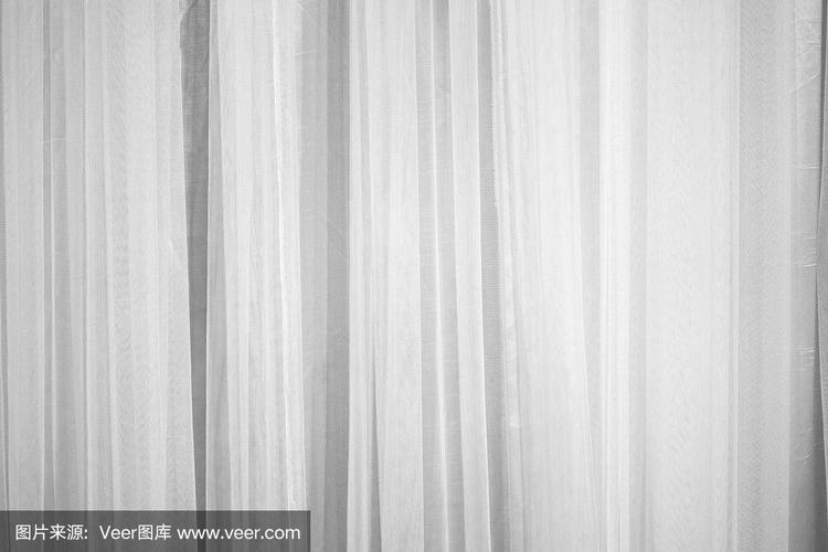 白色窗帘织物花纹表面纹理.设计装饰背景的室内材料特写