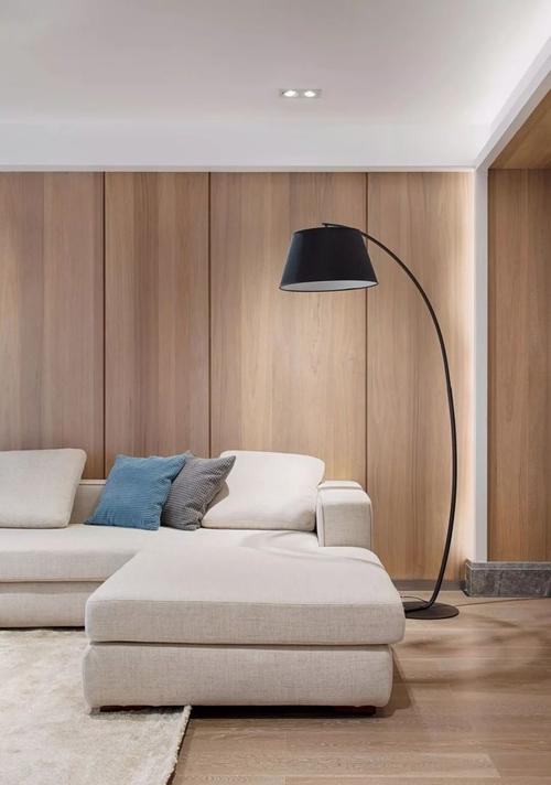 客厅地面通铺木色地板沙发背景采用自然的木饰面板大面积的木